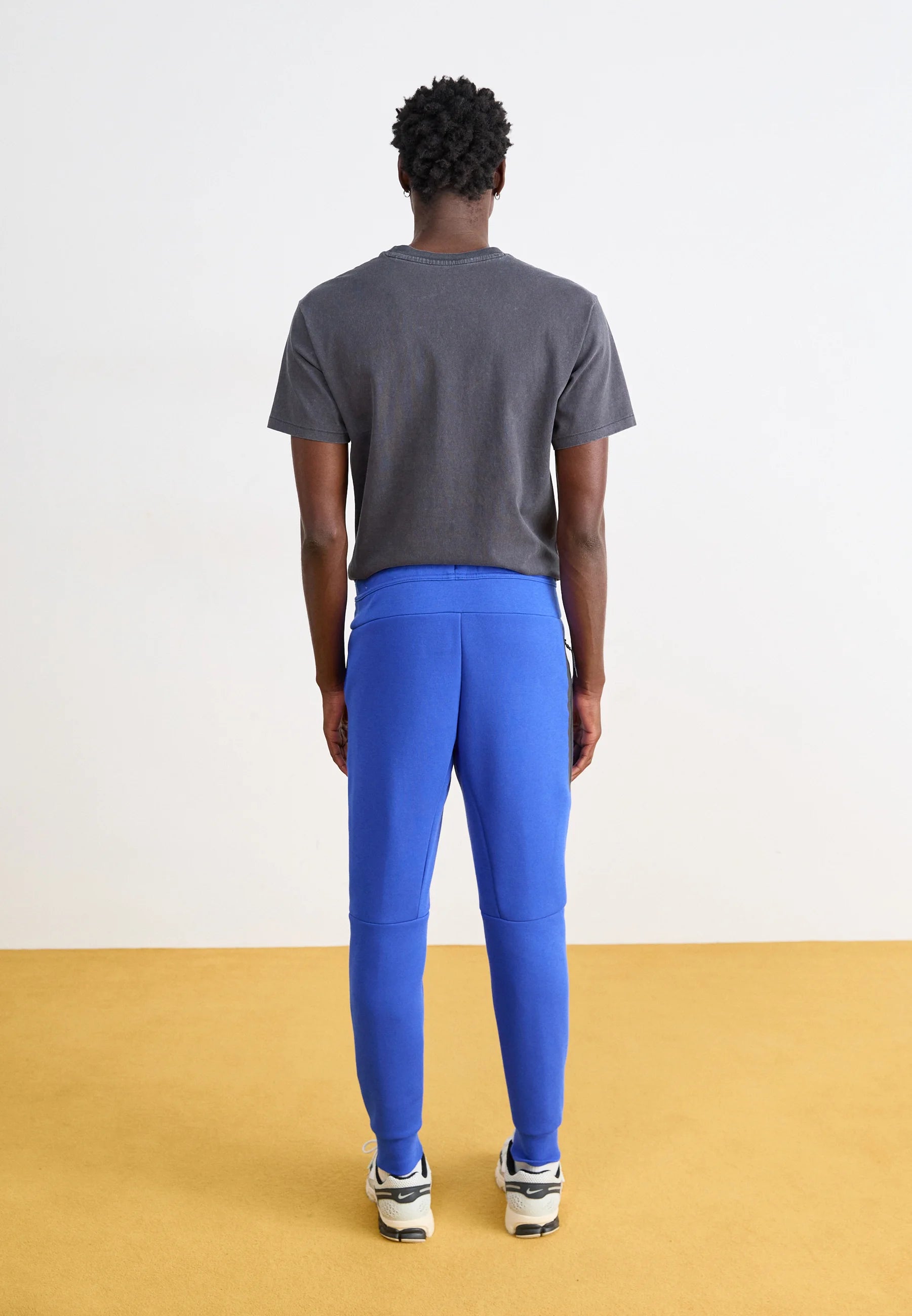 Calça Nike Tech Fleece Windrunner